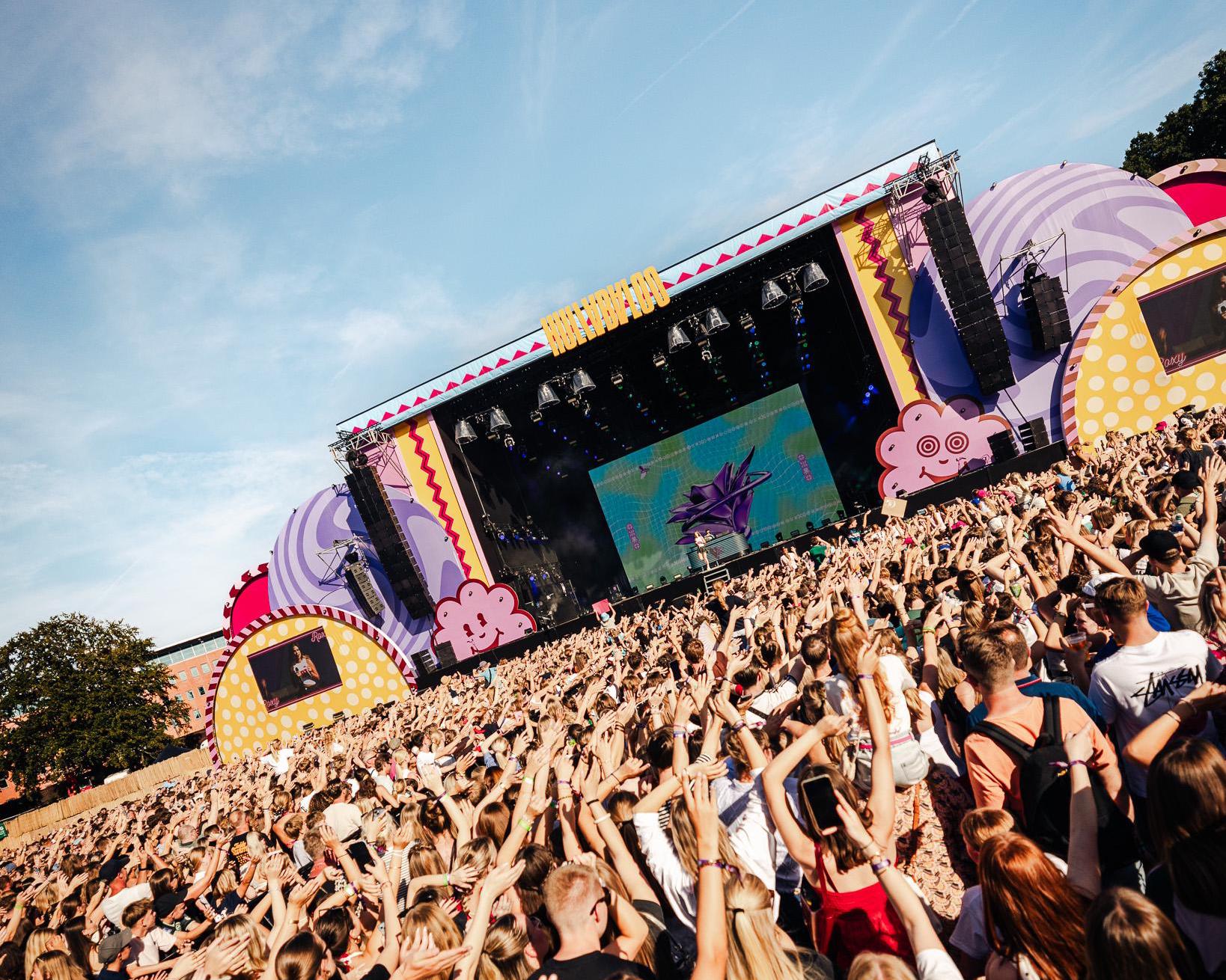 Crowd with their hands in the air in front of the Hullabaloo Festival main stage